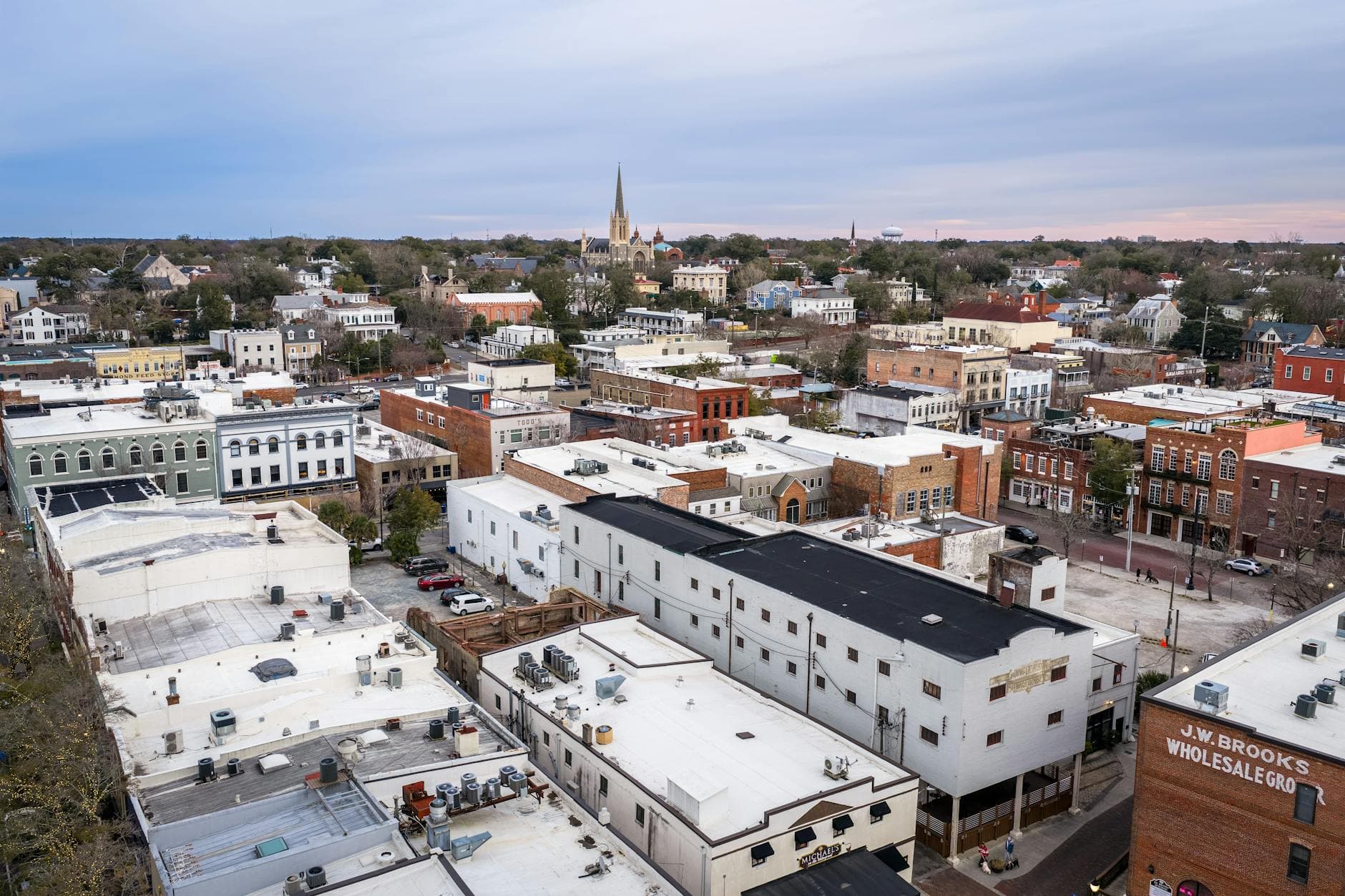 Aerial view of historic downtown Wilmington, NC showcasing urban architecture and church spires.