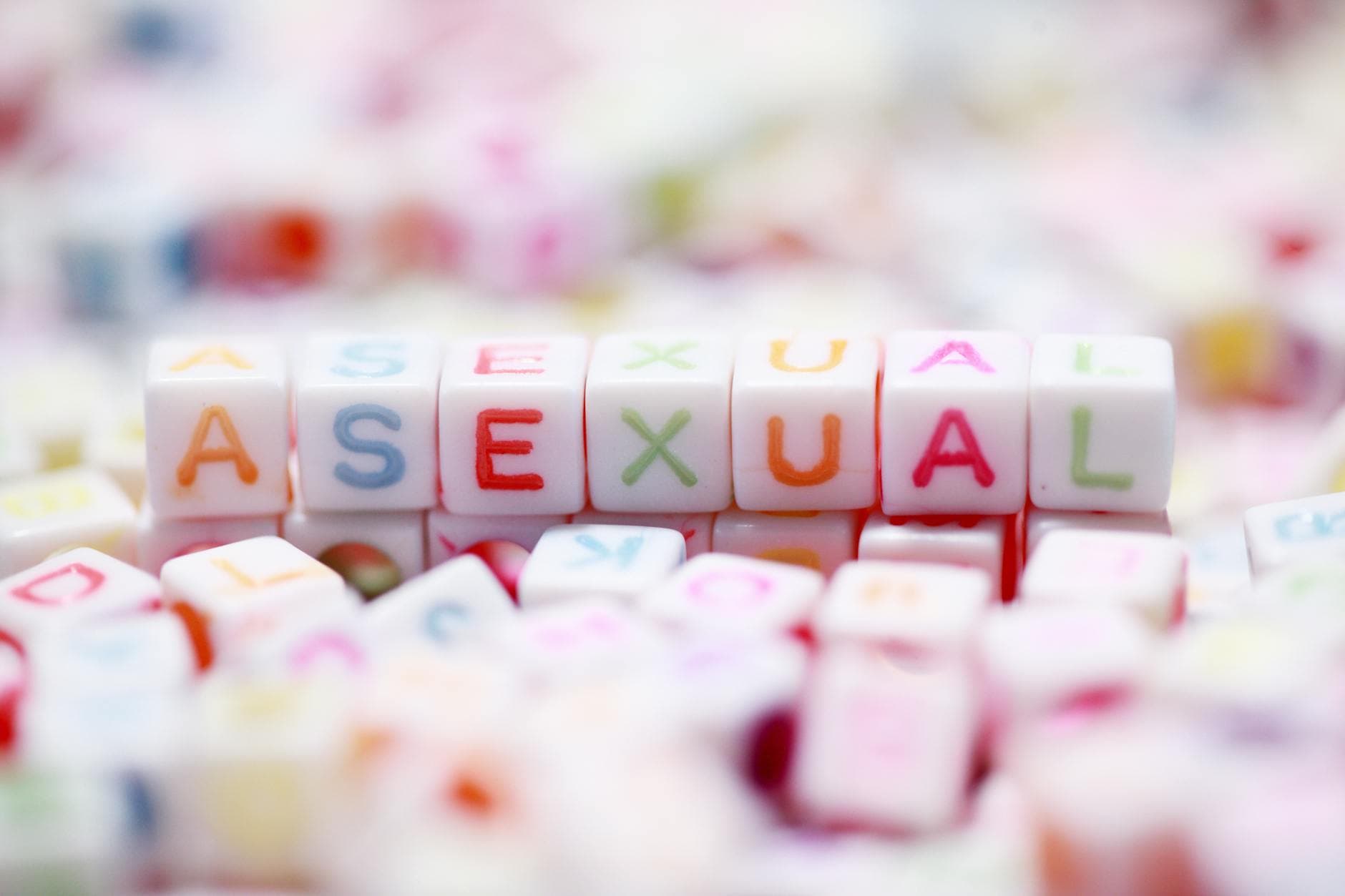 Colorful letter blocks spelling 'asexual' representing LGBTQ pride and identity.